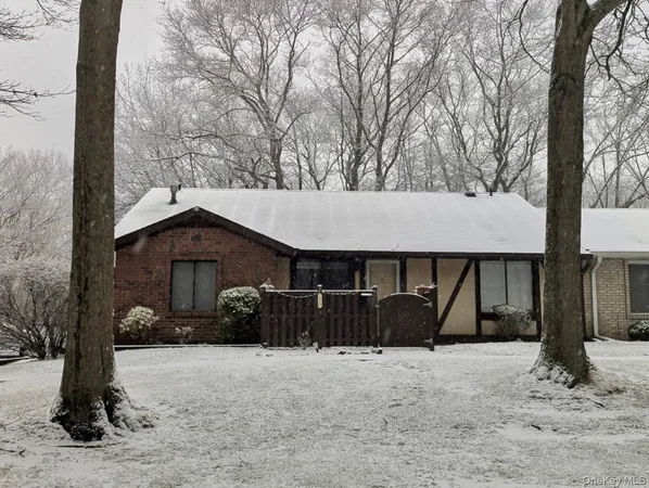 a view of a barn in the middle of a yard