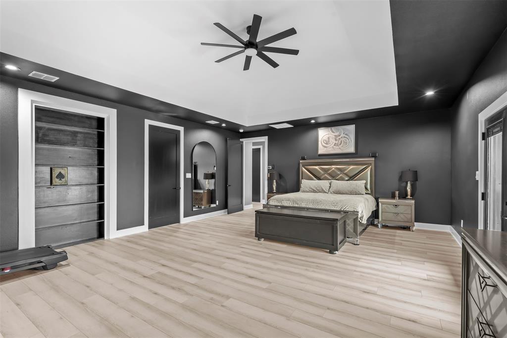 9700 Nix Road Tolar, TX 76476 - Photo 12 of 39 a bedroom with a bed and a chandelier