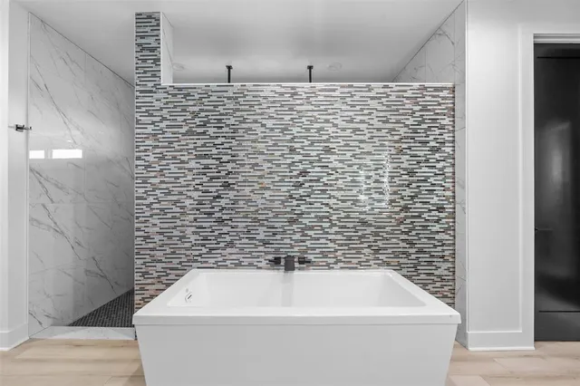 a bathroom with a white wall