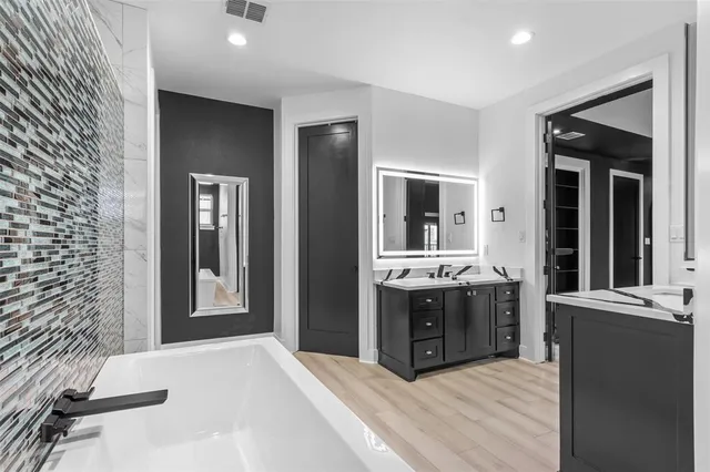 a large kitchen with stainless steel appliances granite countertop a large counter top and stove