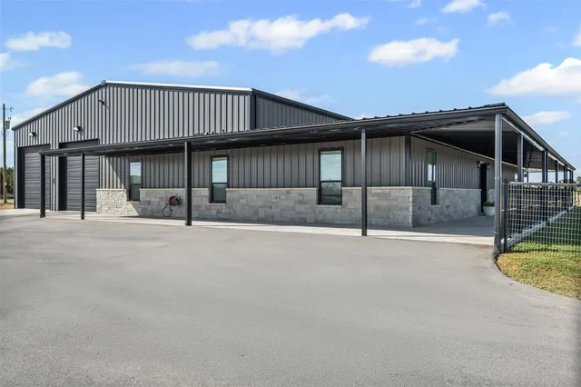 a view of a house with wooden deck