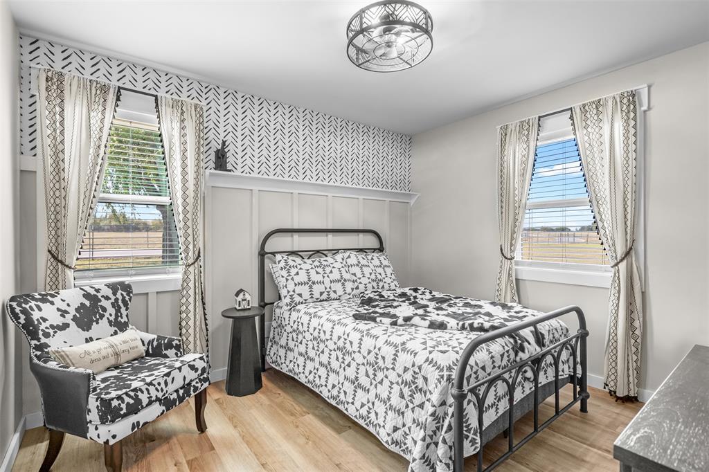 9700 Nix Road Tolar, TX 76476 - Photo 38 of 39 a bedroom with a bed and a chair