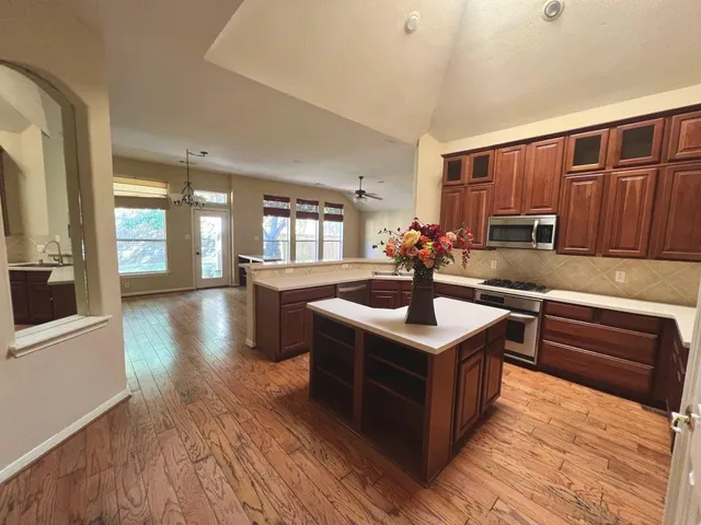 a kitchen with a stove and a sink