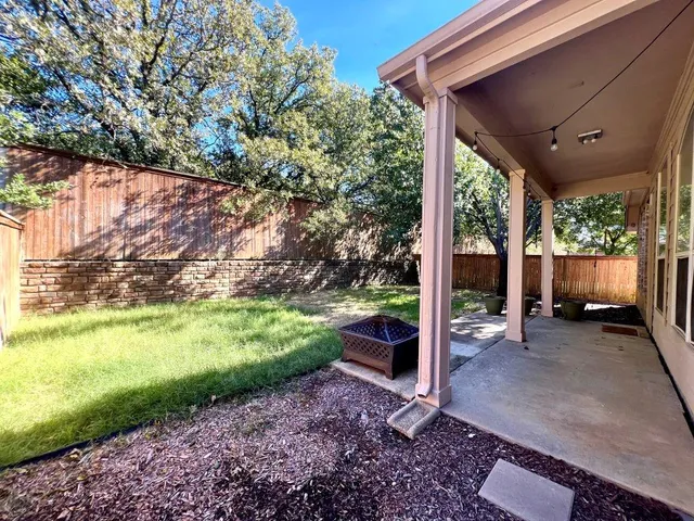 a view of a patio in backyard