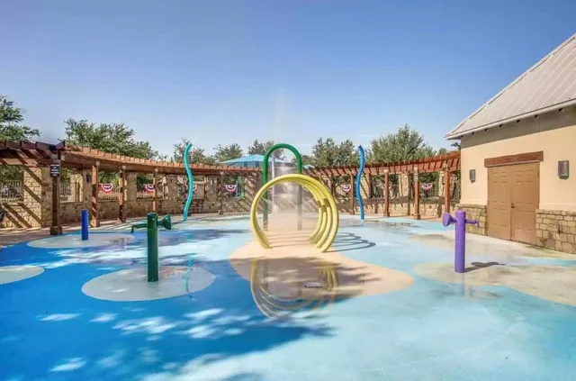 a view of a park with a slide