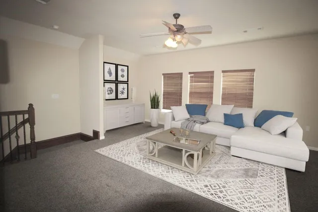 a living room with furniture and window