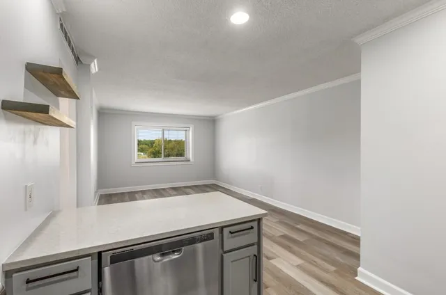 a kitchen with a refrigerator and a sink