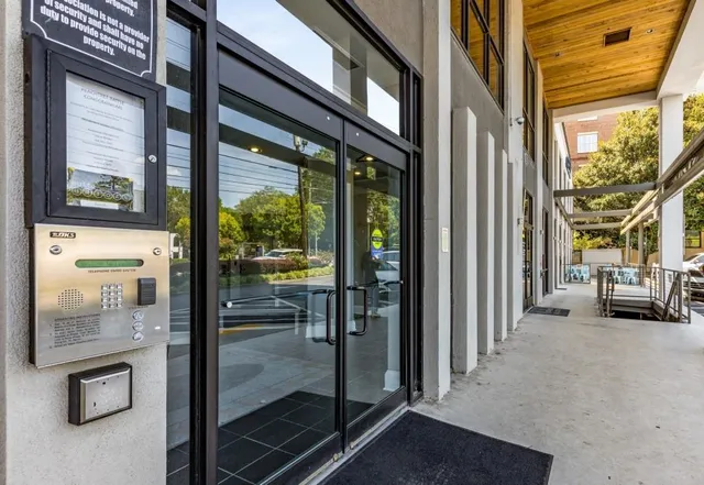 a view of a porch with a floor to ceiling window