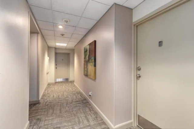 a kitchen with stainless steel appliances a refrigerator and a stove