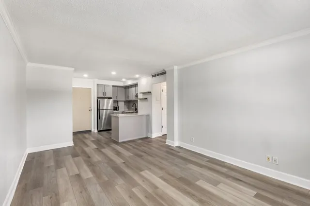 a view of kitchen with wooden floor
