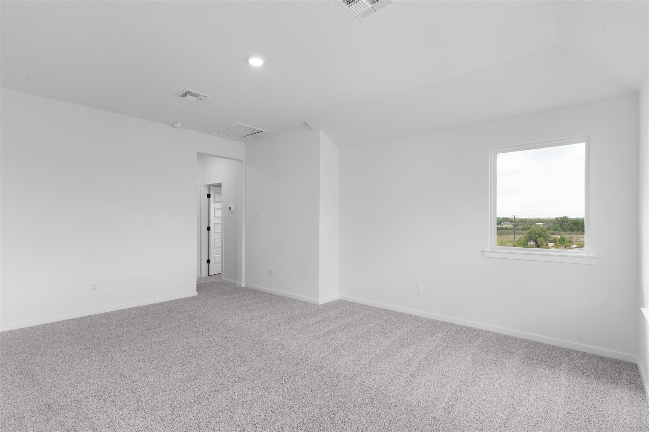 405 Raleigh Drive Georgetown, TX 78633 - Photo 15 of 27 Empty room with light carpet and recessed lighting