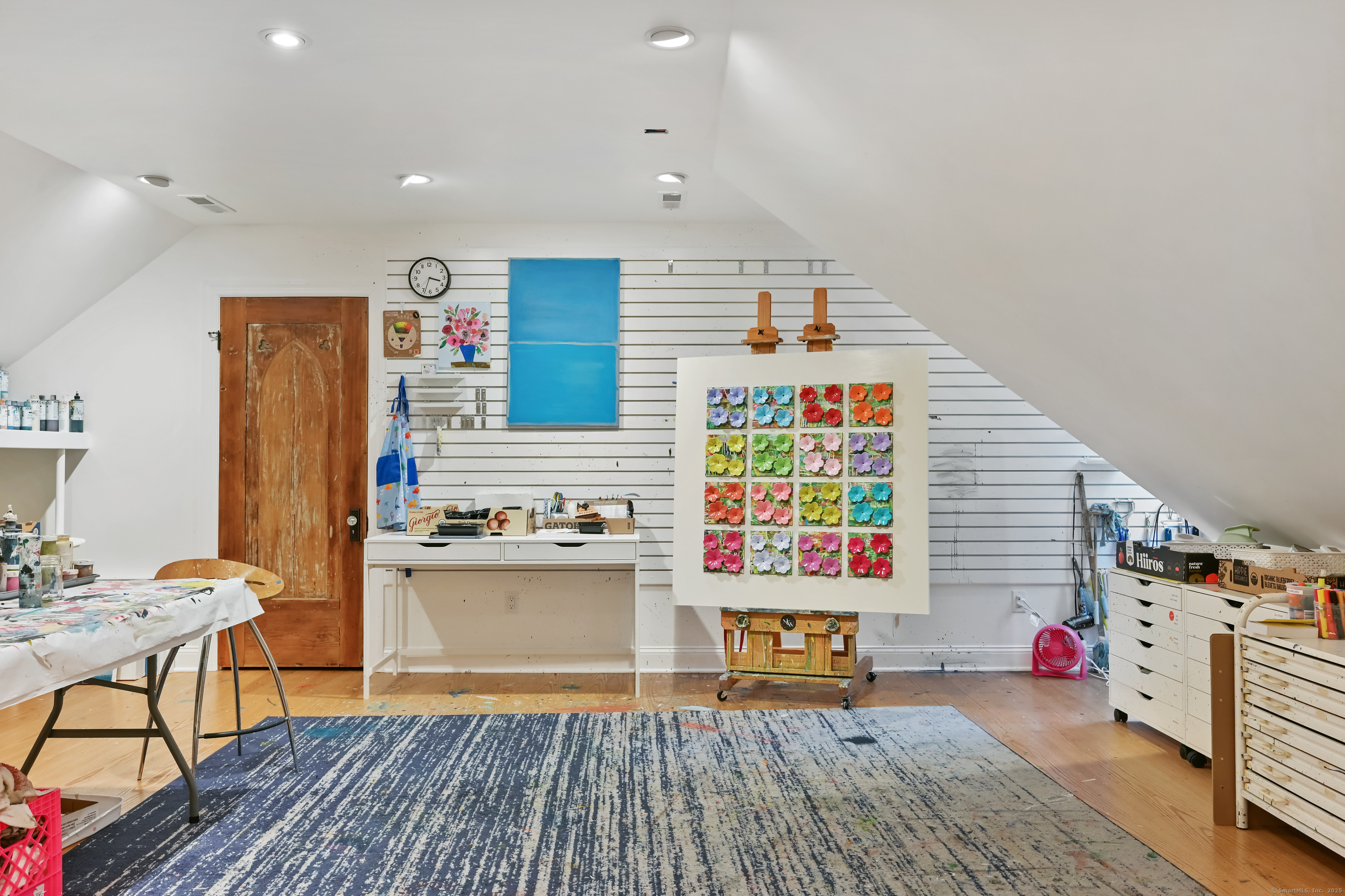 184 Marvin Ridge Road New Canaan, CT 06840 - Photo 30 of 39 a living room with furniture and a wooden floor