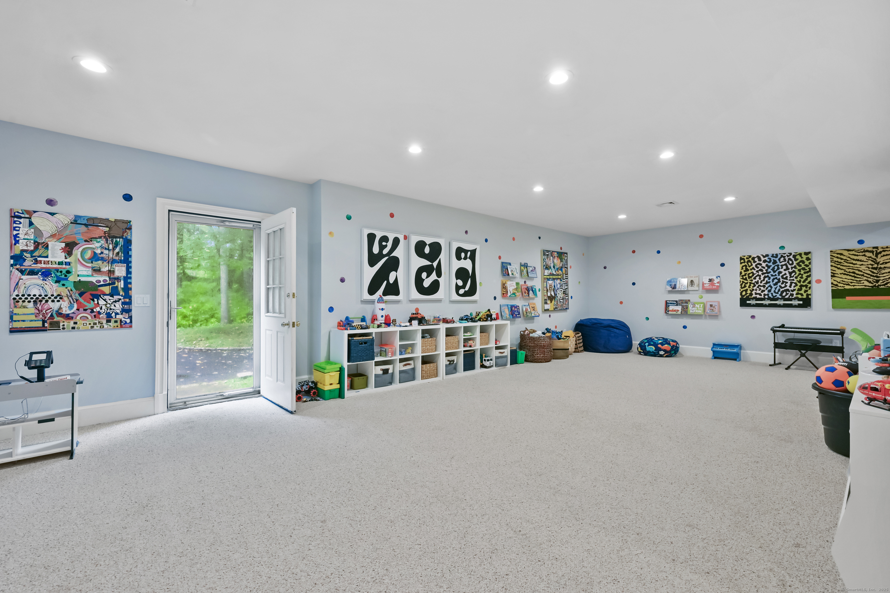 184 Marvin Ridge Road New Canaan, CT 06840 - Photo 32 of 39 a living room with furniture and a flat screen tv