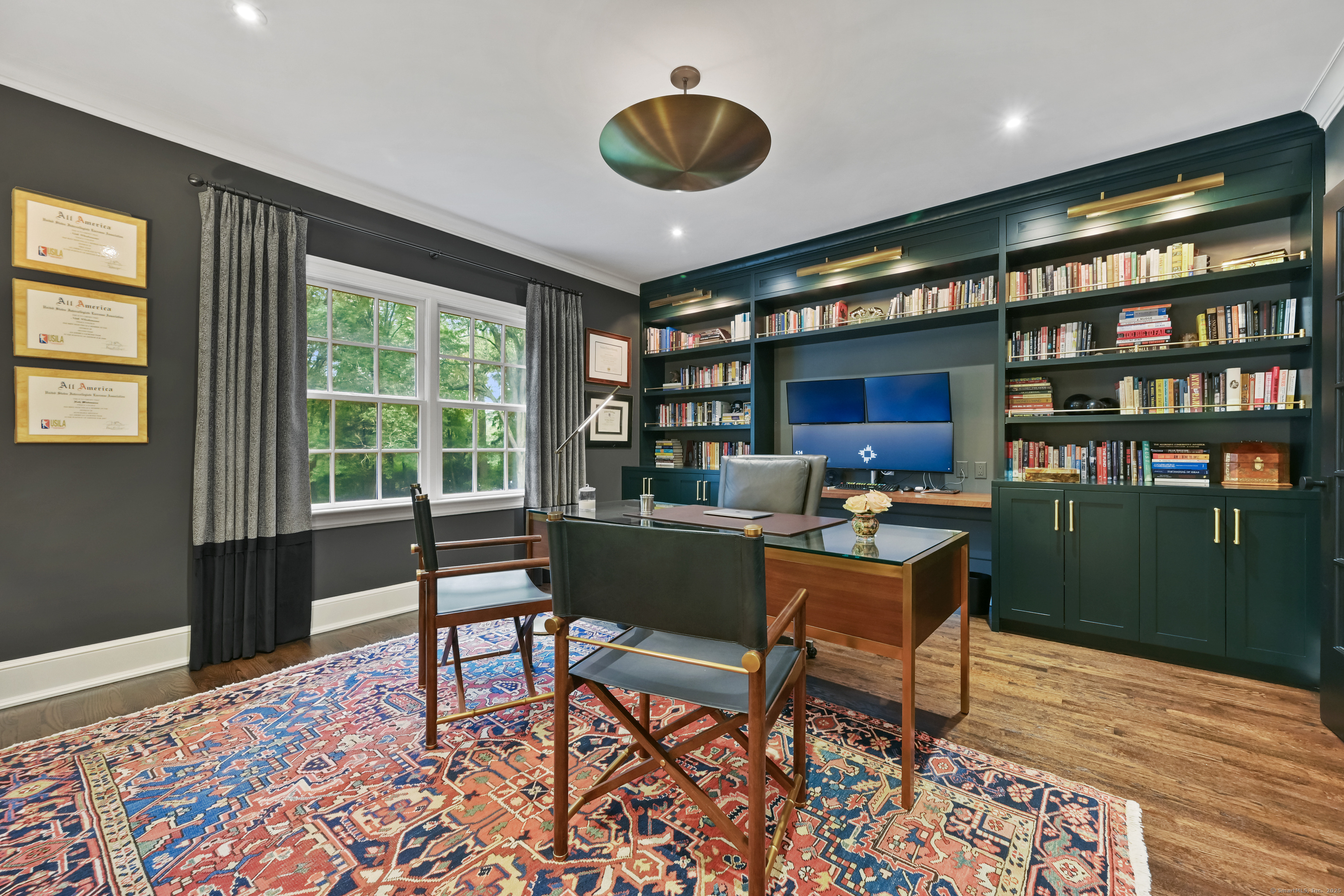 184 Marvin Ridge Road New Canaan, CT 06840 - Photo 7 of 39 a work room with furniture and a book shelf