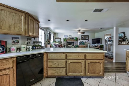 1213 Andrea Court Ridgecrest, CA 93555 - Photo 19 of 50 a kitchen with stainless steel appliances granite countertop a sink and cabinets