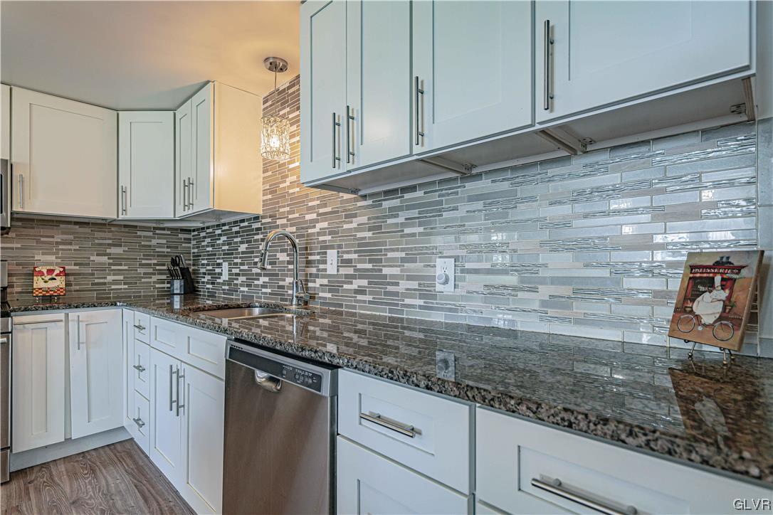 6251 Locust Road Bath, PA 18014 - Photo 13 of 42 a kitchen with granite countertop cabinets sink and cabinets