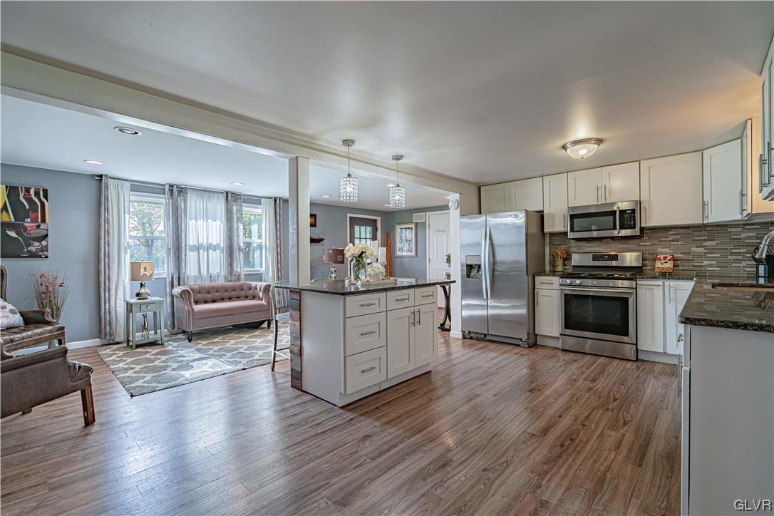 6251 Locust Road Bath, PA 18014 - Photo 14 of 42 a kitchen with stainless steel appliances a refrigerator and a stove top oven