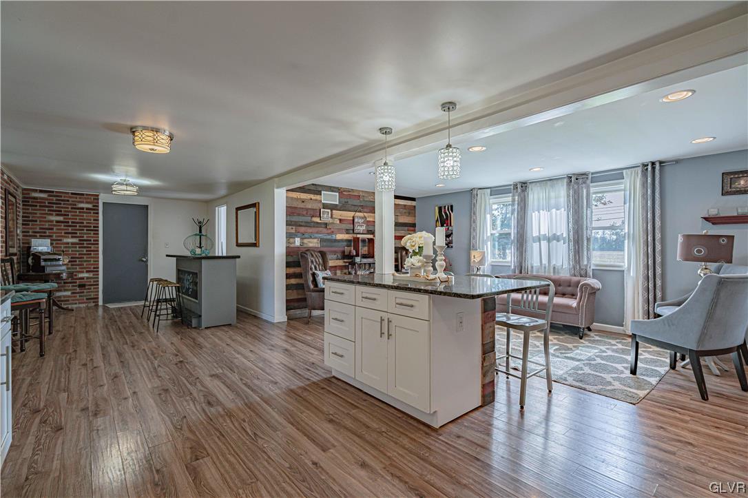 6251 Locust Road Bath, PA 18014 - Photo 15 of 42 a kitchen with stainless steel appliances wooden floor and a table