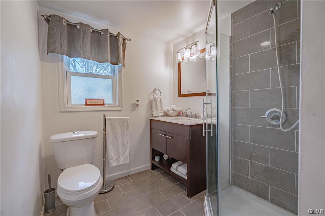 6251 Locust Road Bath, PA 18014 - Photo 30 of 42 a bathroom with a toilet sink and mirror