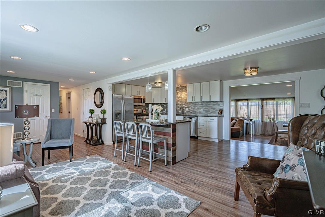 6251 Locust Road Bath, PA 18014 - Photo 9 of 42 a living room with furniture and a dining table with kitchen view