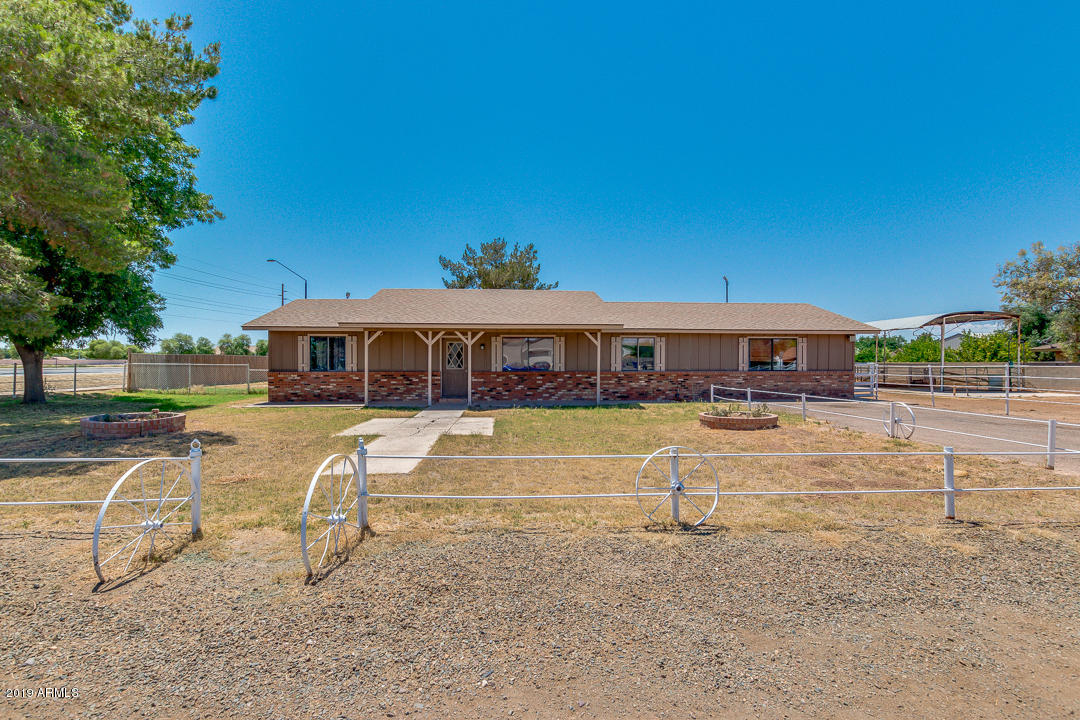 2377 East Willis Road Gilbert, AZ 85297 - Photo 1 of 11 a swimming pool with outdoor seating and yard