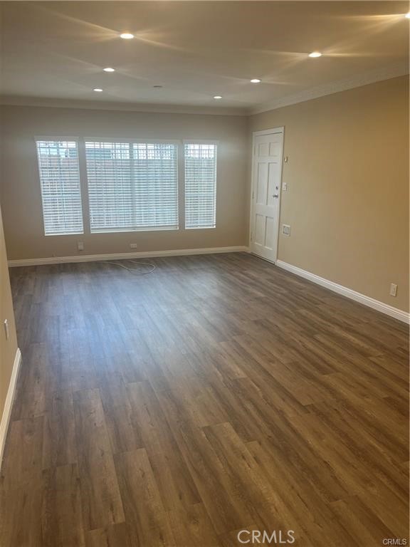 1915-1917 South Orange Drive Los Angeles, CA 90016 - Photo 5 of 11 an empty room with wooden floor and windows