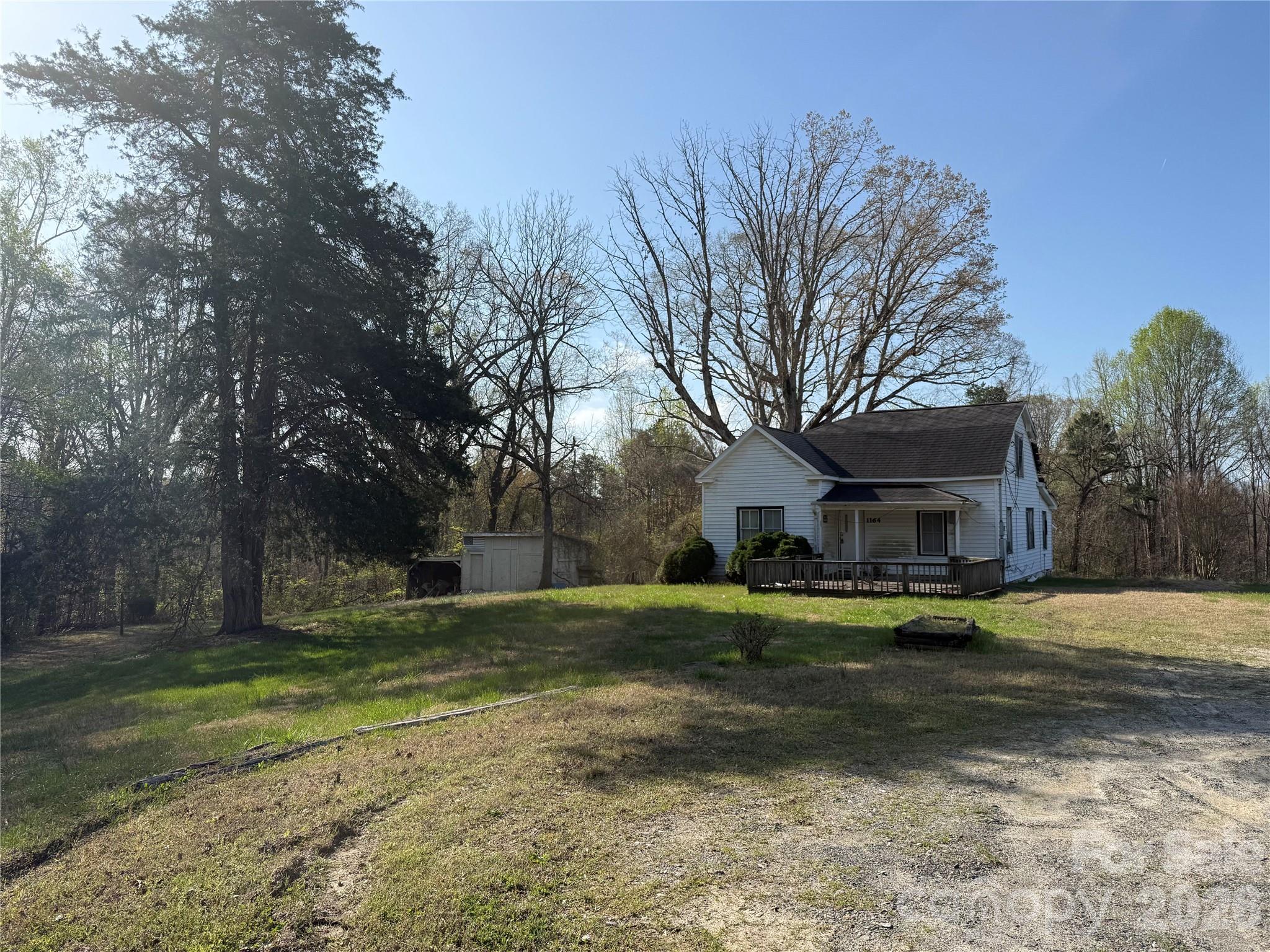 1164 Robert C Kellam Road Pinnacle, NC 27043 - Photo 11 of 48 a view of a house with a yard
