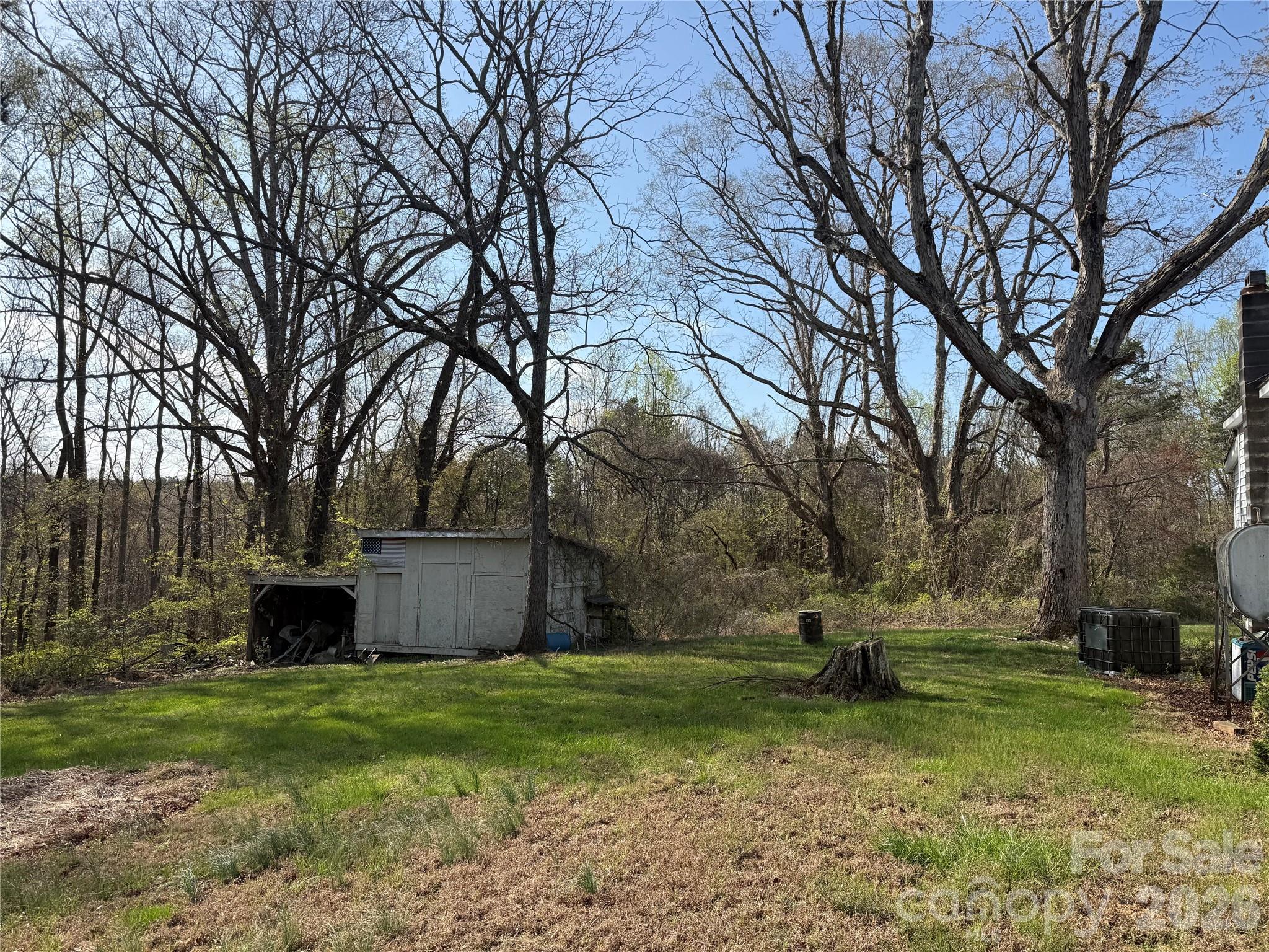1164 Robert C Kellam Road Pinnacle, NC 27043 - Photo 13 of 48 a view of a backyard with large trees