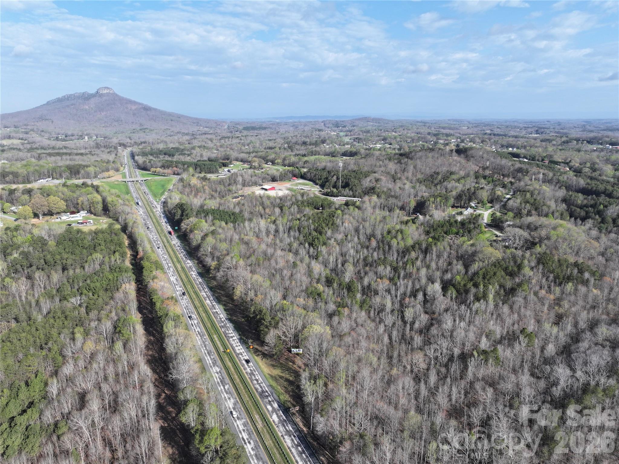 1164 Robert C Kellam Road Pinnacle, NC 27043 - Photo 3 of 48 an aerial view of residential houses with outdoor space and trees