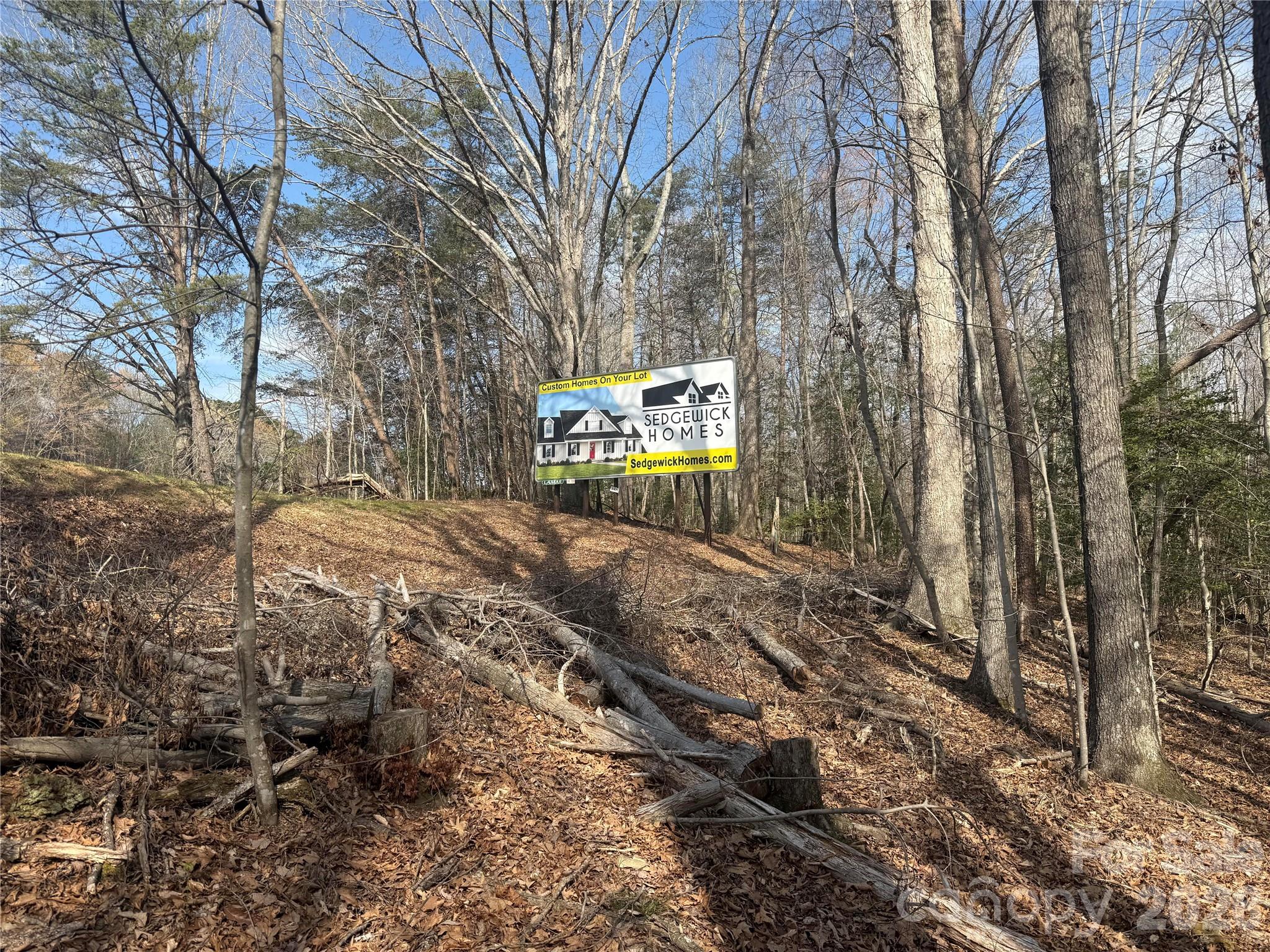 1164 Robert C Kellam Road Pinnacle, NC 27043 - Photo 39 of 48 a sign board with a yard