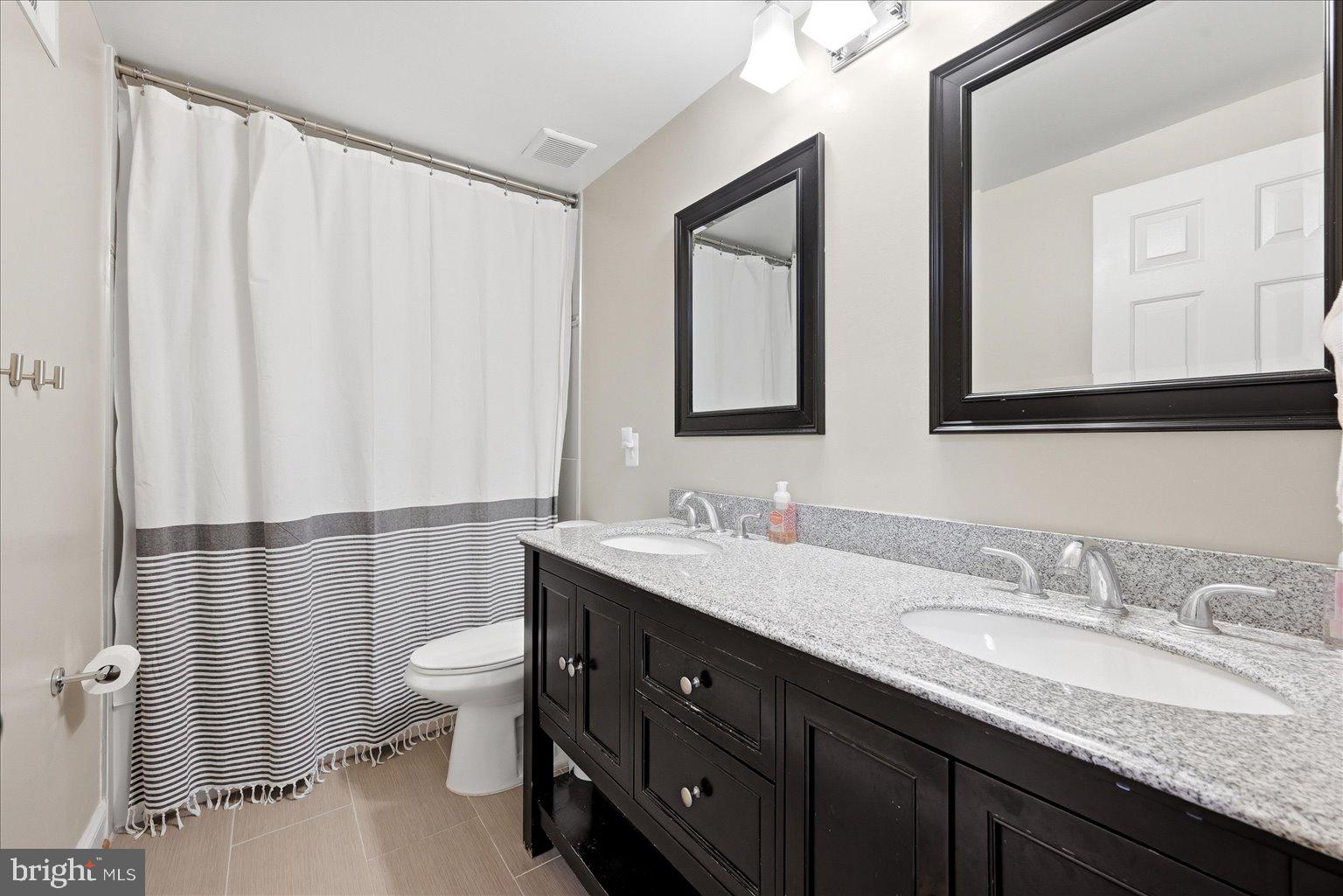 911 Riva Ridge Drive Great Falls, VA 22066 - Photo 37 of 55 Modern bathroom with elegant finishes.
