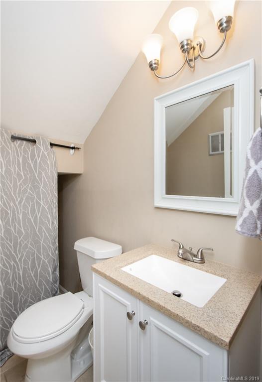 5941 Quail Hollow Road, Unit A Charlotte, NC 28210 - Photo 14 of 26 a bathroom with a sink and a toilet