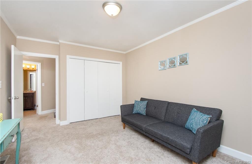 5941 Quail Hollow Road, Unit A Charlotte, NC 28210 - Photo 17 of 26 a living room with a couch