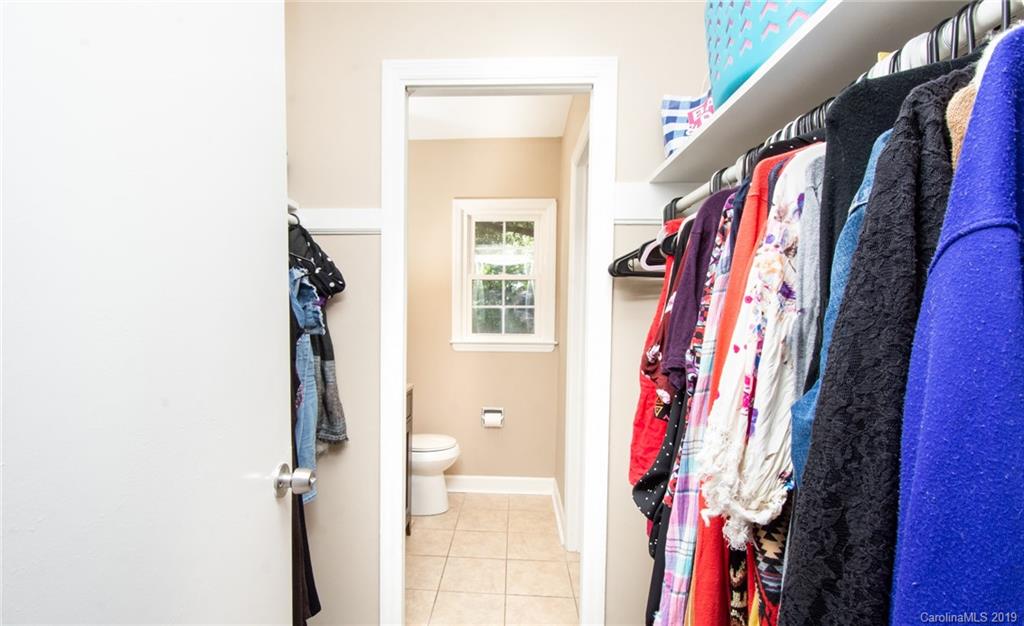 5941 Quail Hollow Road, Unit A Charlotte, NC 28210 - Photo 19 of 26 a view of walk in closet with clothes and shoes