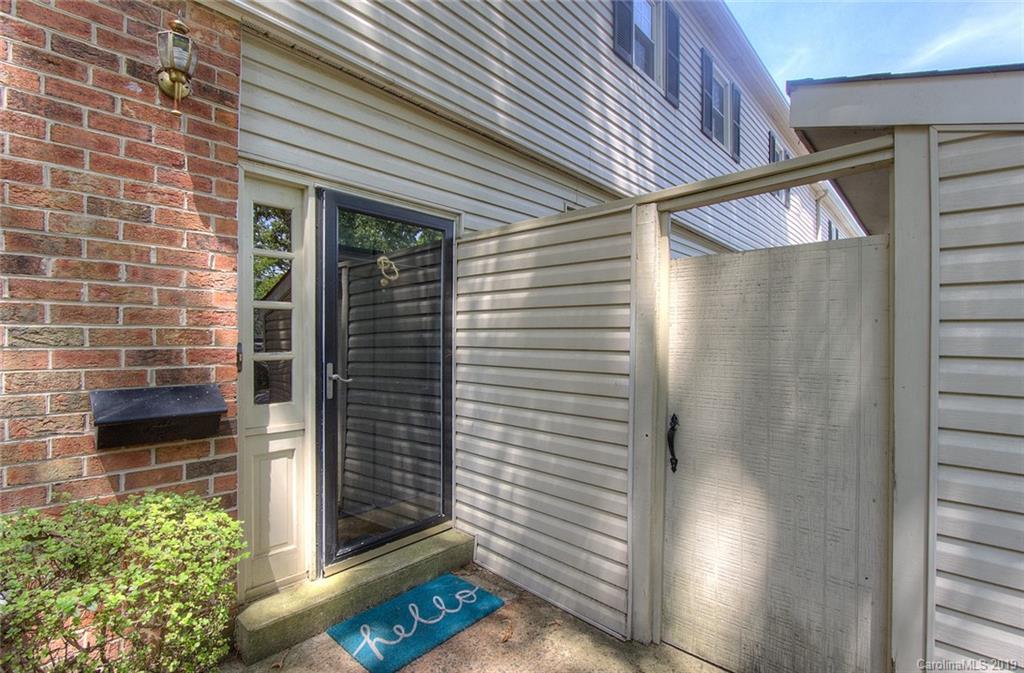5941 Quail Hollow Road, Unit A Charlotte, NC 28210 - Photo 3 of 26 a view of a door and an outdoor space