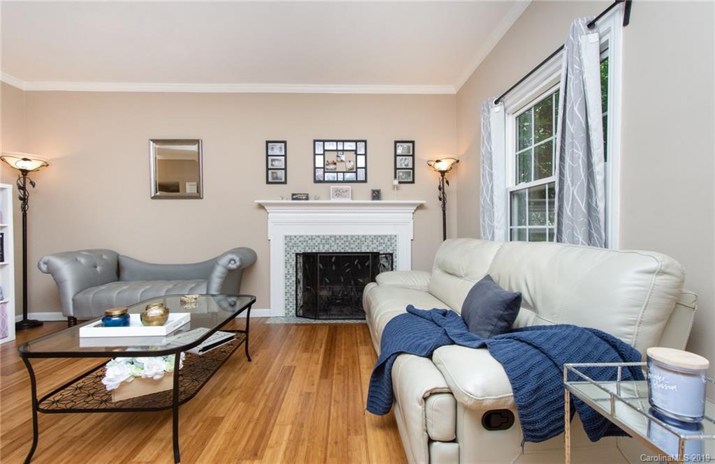 5941 Quail Hollow Road, Unit A Charlotte, NC 28210 - Photo 4 of 26 a living room with furniture and a fireplace