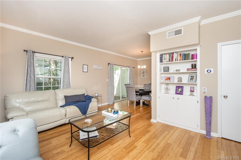 5941 Quail Hollow Road, Unit A Charlotte, NC 28210 - Photo 6 of 26 a living room with furniture a rug and a window