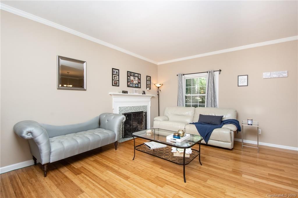 5941 Quail Hollow Road, Unit A Charlotte, NC 28210 - Photo 7 of 26 a living room with furniture and a fireplace