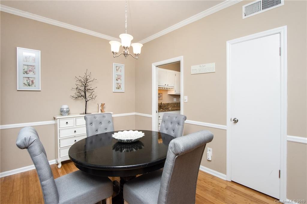 5941 Quail Hollow Road, Unit A Charlotte, NC 28210 - Photo 9 of 26 a view of a dining room with furniture and wooden floor