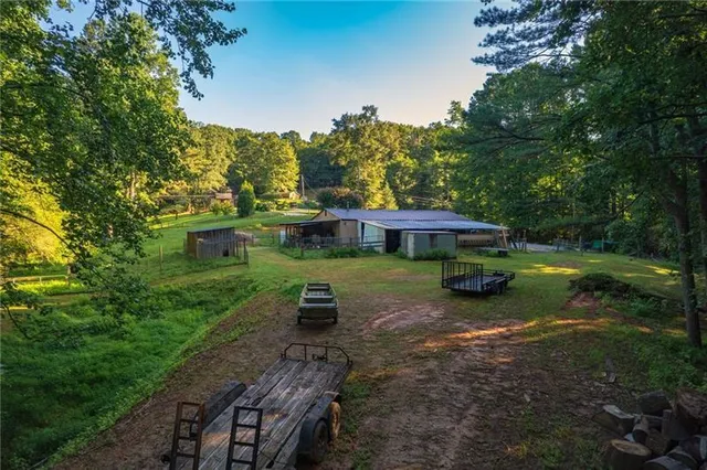 an aerial view of a house with garden space and street view