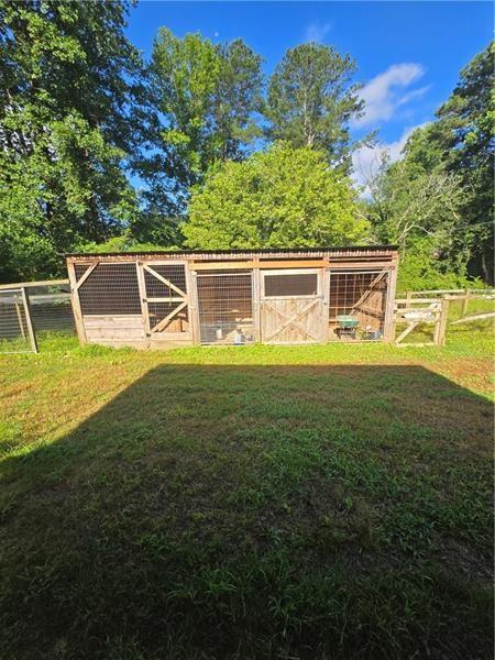 365 Russell King Lane Canton, GA 30115 - Photo 20 of 22 a view of a house with a yard