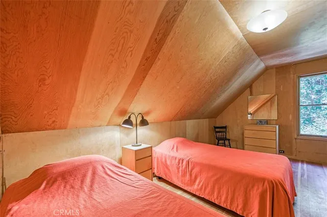 a bedroom with bed and window