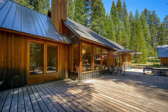a view of a house with a large window and wooden floor