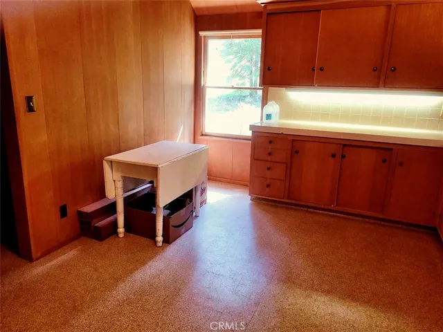 a kitchen with wooden cabinets and sink
