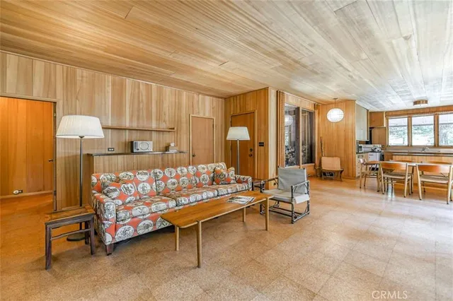 a bedroom with furniture and a chandelier