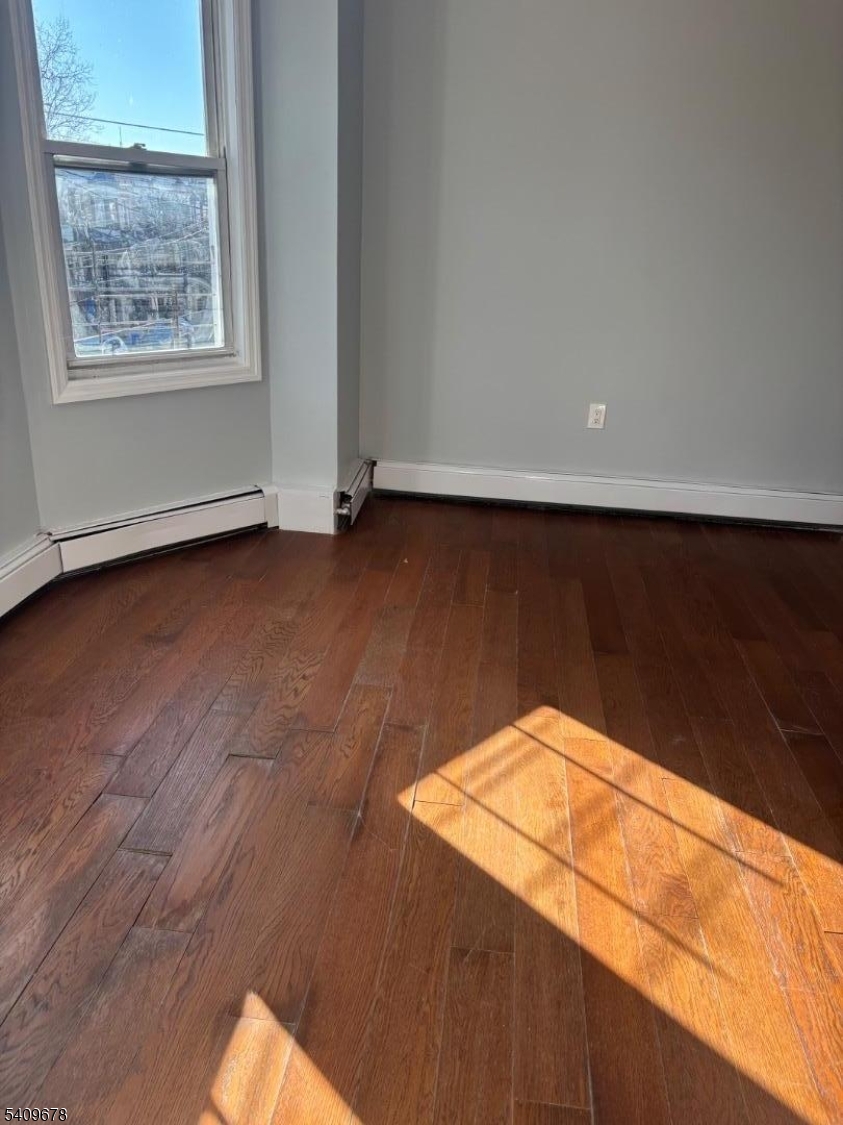 309 South 11th Street, Unit 2 Newark, NJ 07103 - Photo 12 of 13 a view of an empty room and window