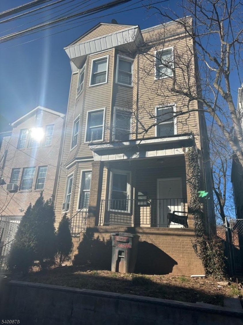309 South 11th Street, Unit 2 Newark, NJ 07103 - Photo 3 of 13 a view of building with front door