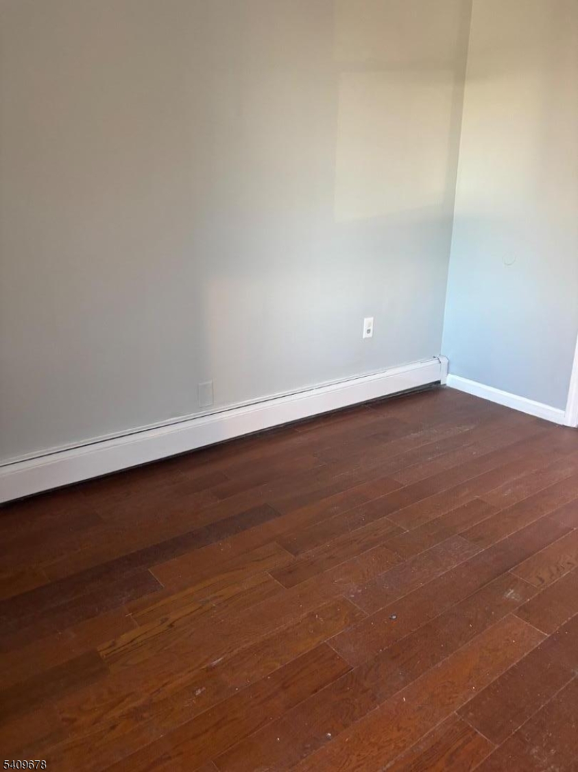 309 South 11th Street, Unit 2 Newark, NJ 07103 - Photo 4 of 13 a view of an empty room with wooden floor