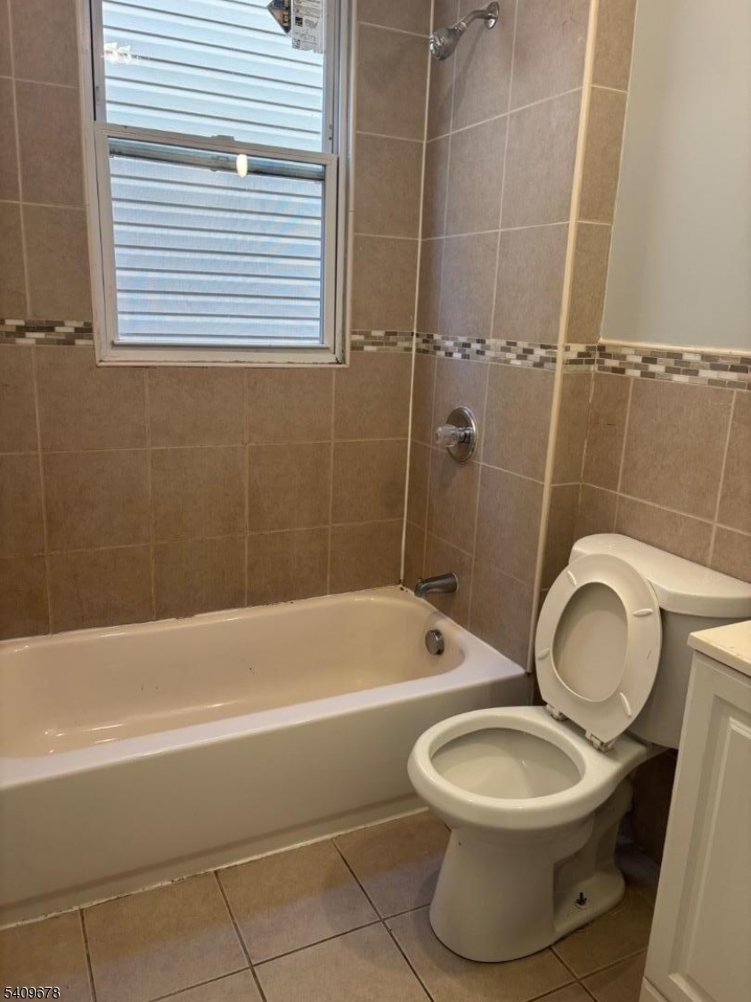 309 South 11th Street, Unit 2 Newark, NJ 07103 - Photo 7 of 13 a bathroom with a toilet a sink and bathtub