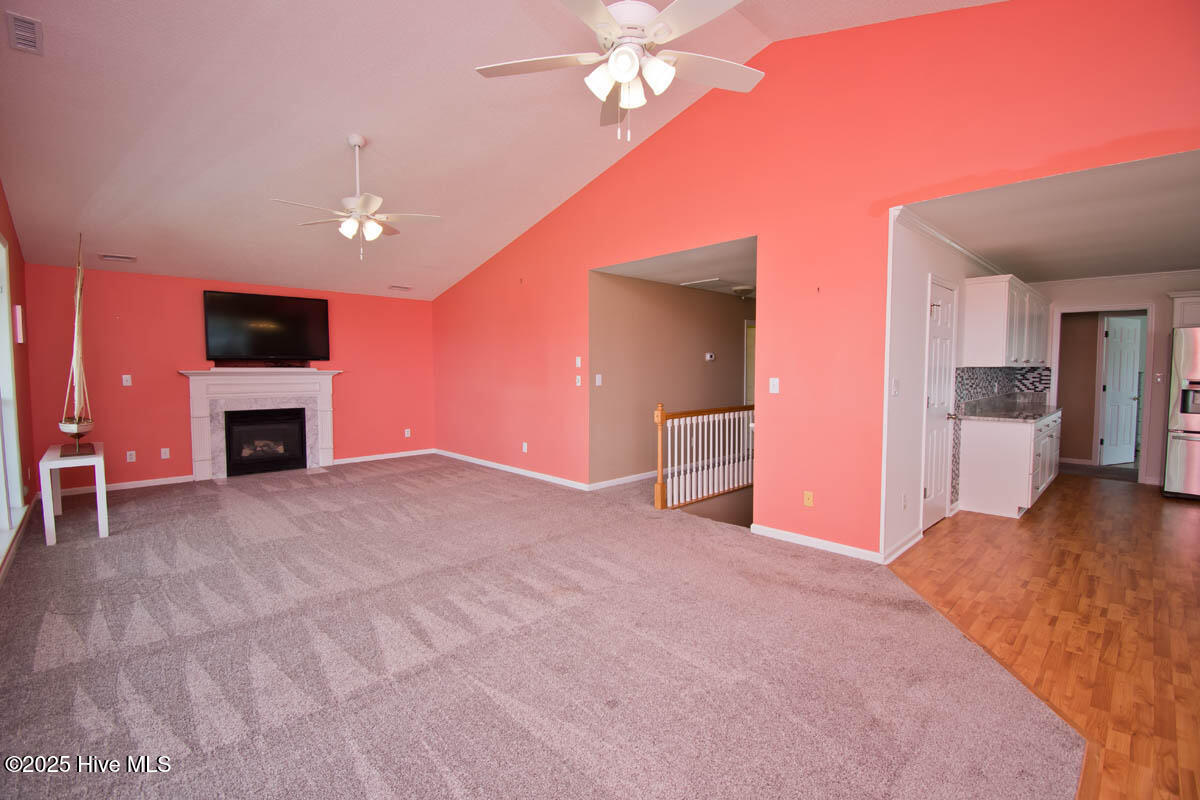 174 Jones Street Cedar Point, NC 28584 - Photo 11 of 52 Open Living Area with Gas Fireplace